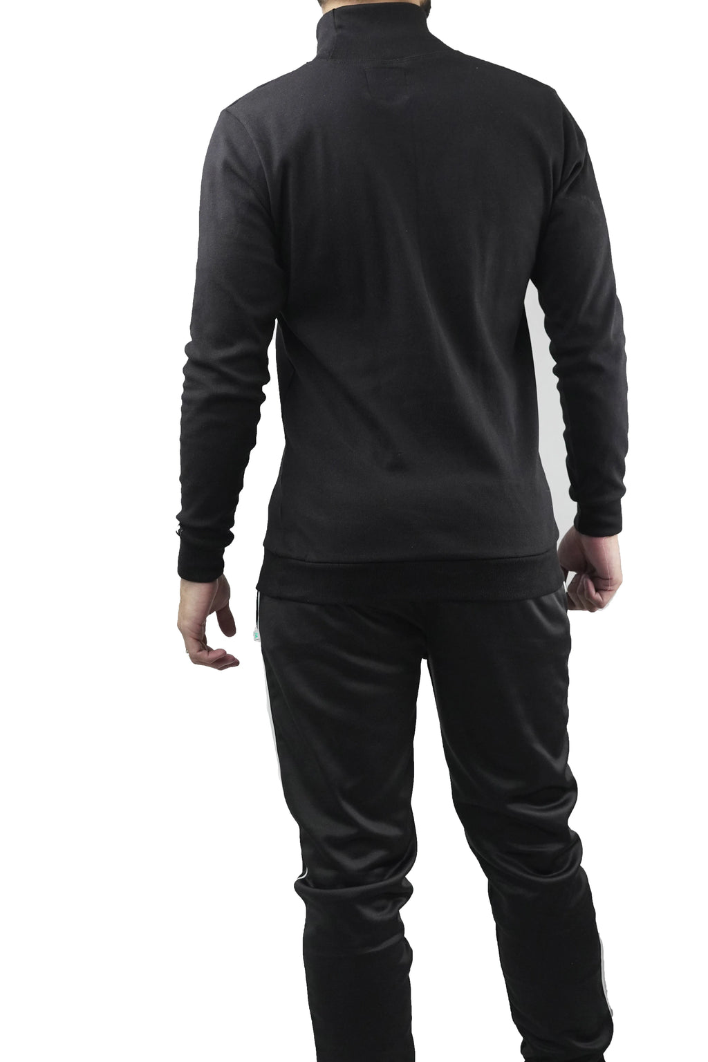 Person wearing a black tracksuit on a white background