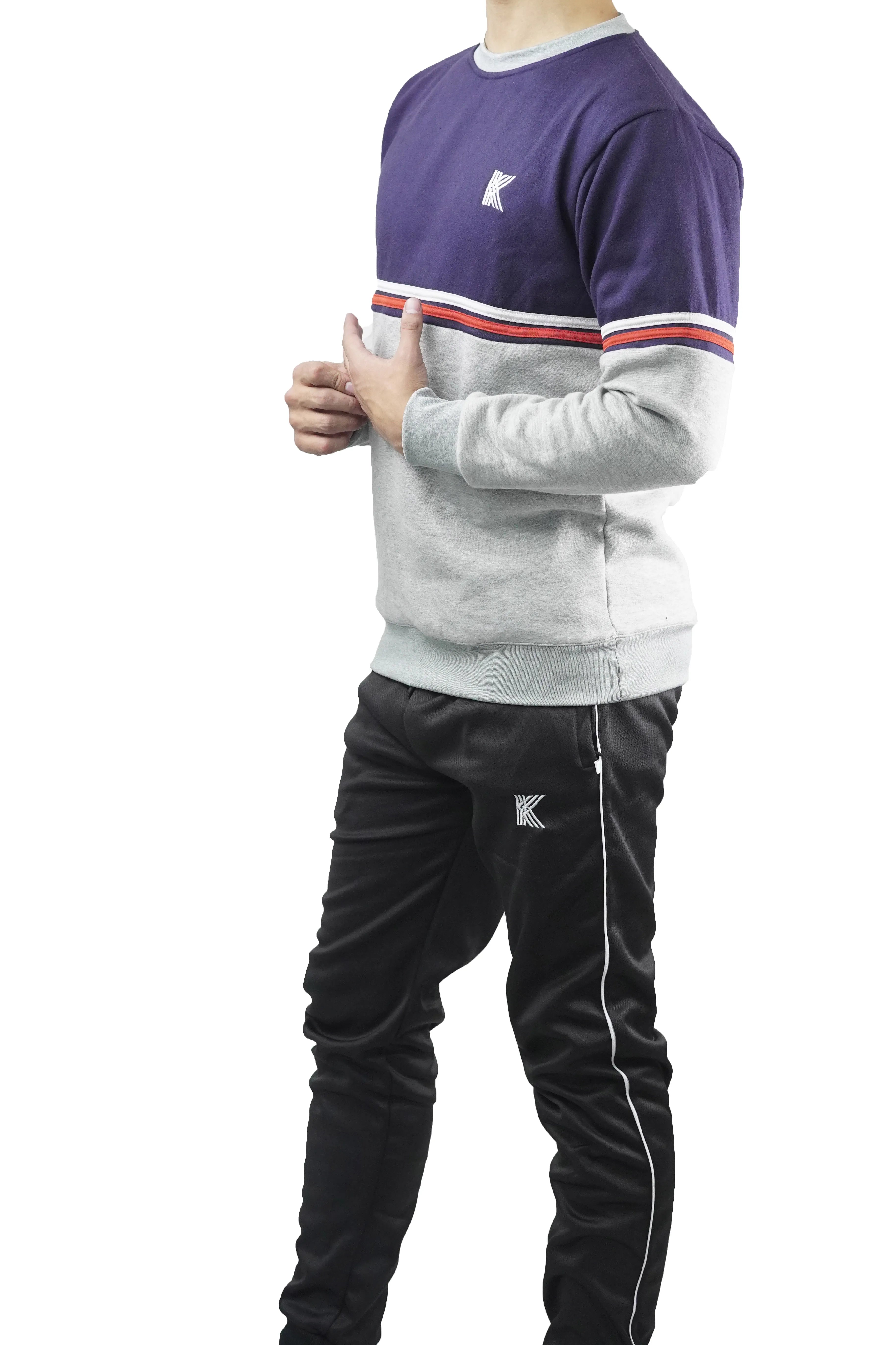 Person wearing a tracksuit with a brand logo on a white background